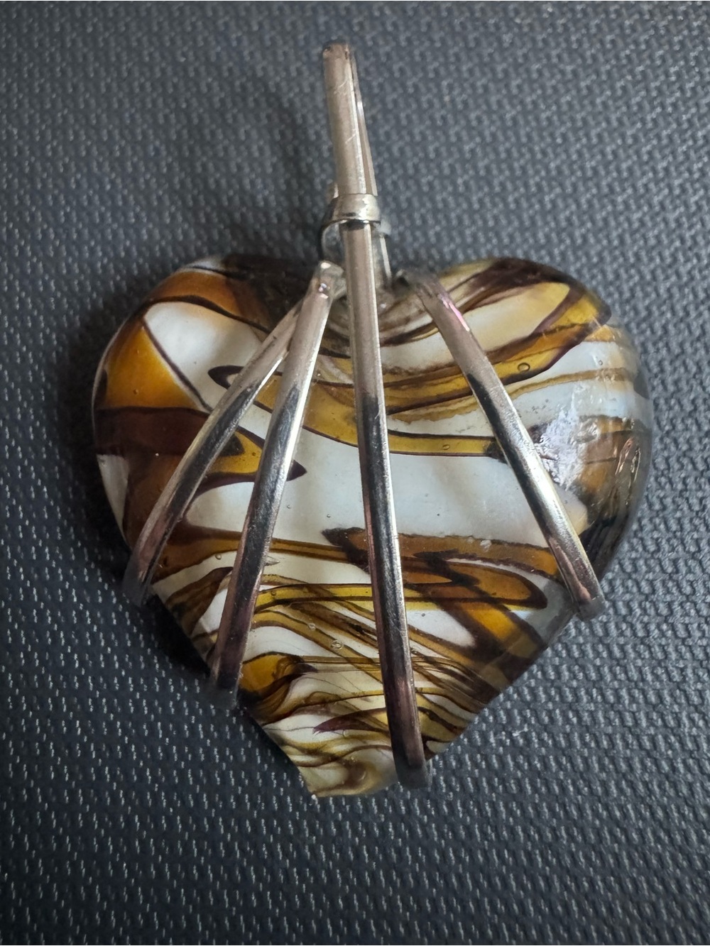 Glass Heart Pendant in Silver Tone. Cage Setting, Amber Swirl Lampwork